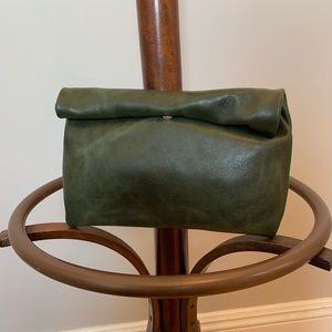 Green leather roll-top clutch